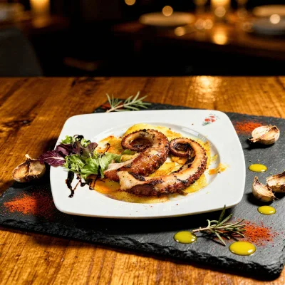 Grilled octopus dish — AI generated