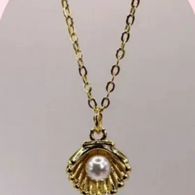 Gold necklace with pearl — before and after